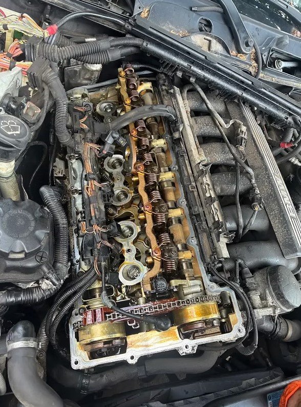 Engine valve cover and timing components under repair